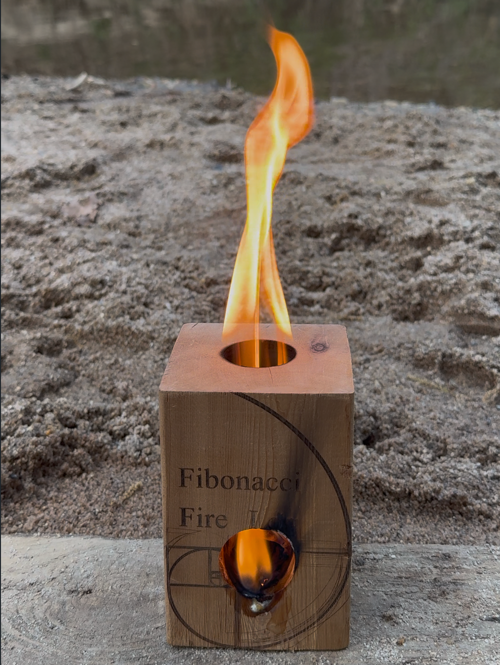 Portable Cedar Firestove burning outdoors